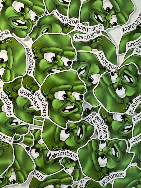 D.A.K 3-inch die-cut sticker featuring a cartoony shocked face, green gun, and ear gauges in a bold, animated design.