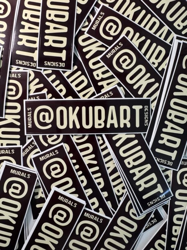 @OKUBART 6x2 inch die-cut promotional sticker featuring deep red text on an off-white background with ‘murals’ and ‘designs’ on the sides.